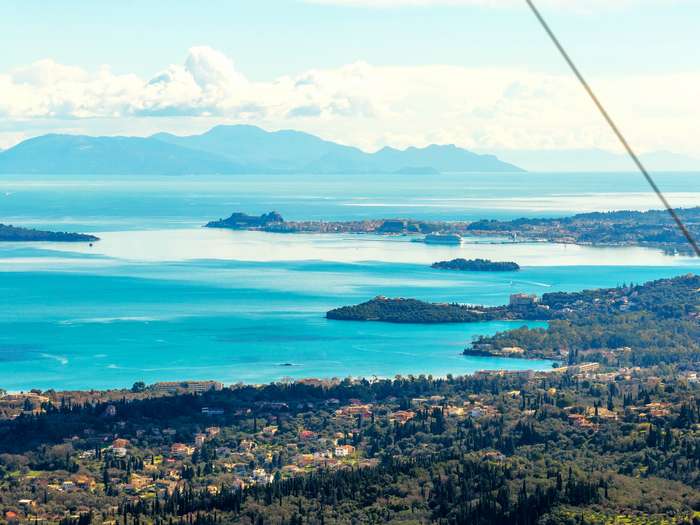 Stunning aerial panorama from Sokraki over the Ionian Sea, showing Corfu town_tn