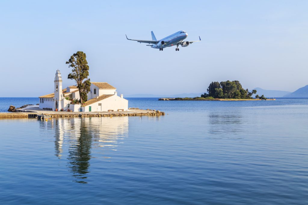 Passenger plane approaches Corfu airport during summer in Grecce Island of Corfu (Kerkyra) CFU