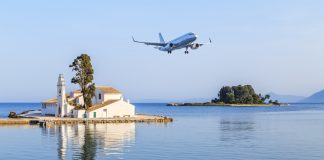 Passenger plane approaches Corfu airport during summer in Grecce Island of Corfu (Kerkyra) CFU
