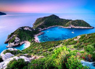 10 Amazing Things Corfu Is Known For Aerial view on famous Porto Timoni holiday beach on Corfu Island before sunrise-1